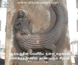 A sculpture on the stone pillar